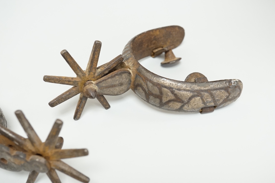 Three Spanish Colonial niello work and iron spurs, 14cm long